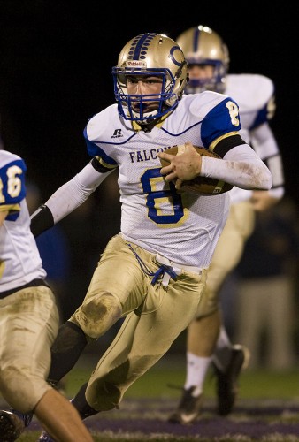 Central's Hank Hoover carries the ball against Strasburg on October 30. The Falcons travel to Buffalo Gap tonight for the first round of the Group 2A East playoffs. Rich Cooley/Daily